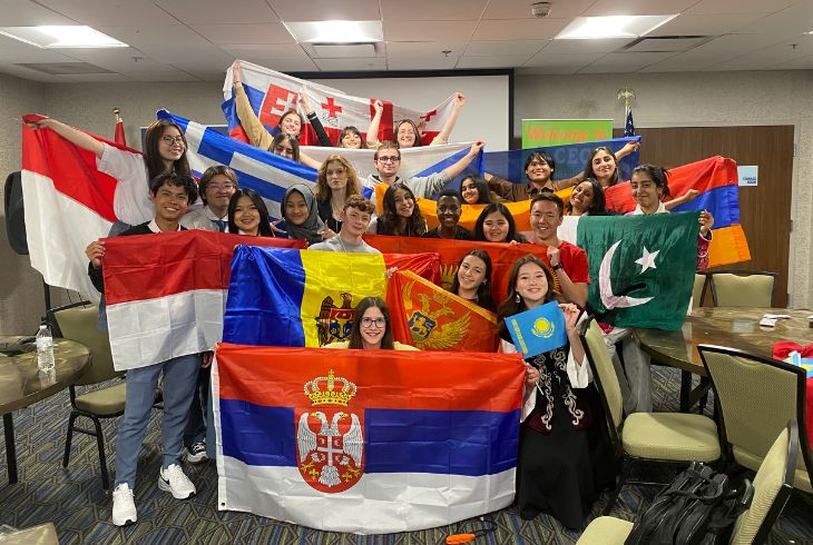 YFU Students holding up flags.