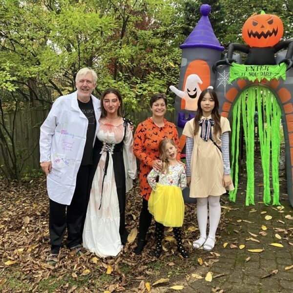 A family with their exchange student celebrating Halloween with costumes and trick-or-treating.