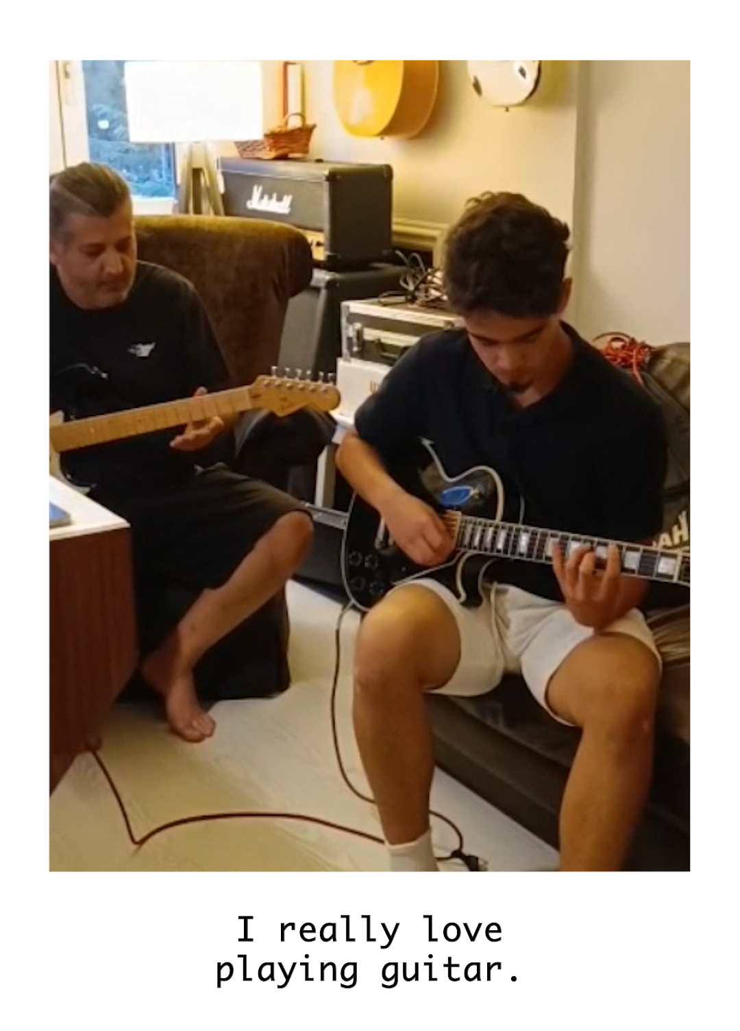 Image of a student playing the guitar