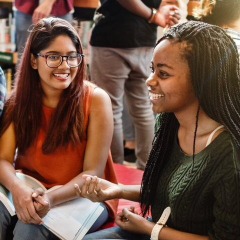 A group of students reading together and language learning